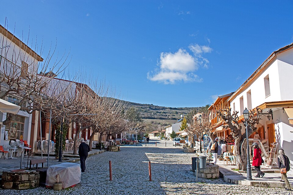 People walking along the village square in Omodos, Cyprus