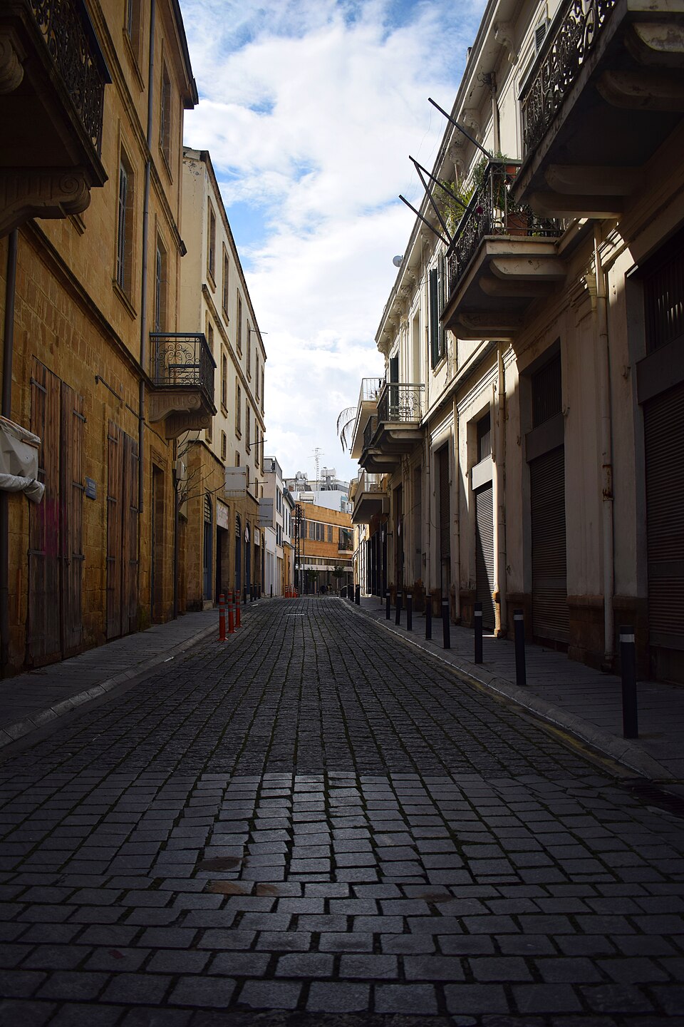 A cobbled street between historic buildings in old Nicosia